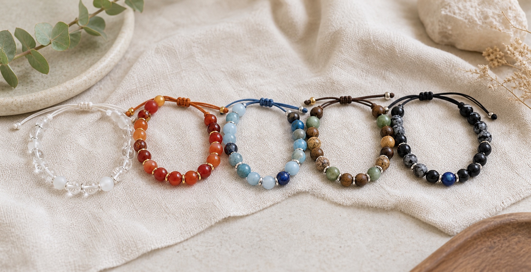Element inspired bracelet styles arranged on a jewelry table